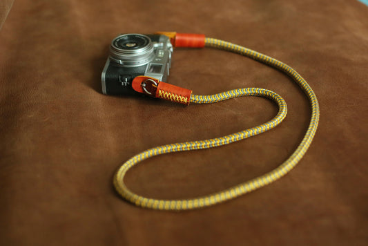 Yellow and gray climbing rope camera strap with leather ends