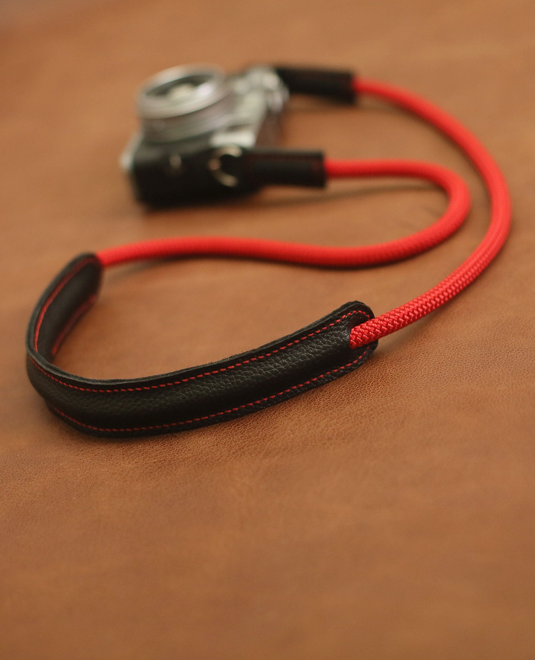 Handmade red rope camera strap with litchi-texture leather padding