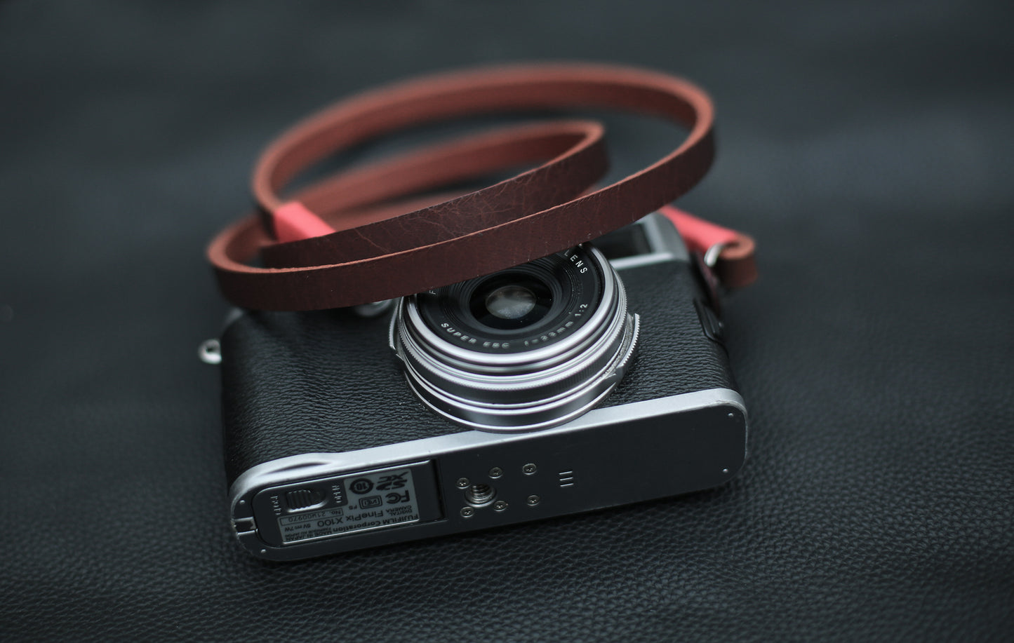 Minimalist brown camera strap with black leather accents