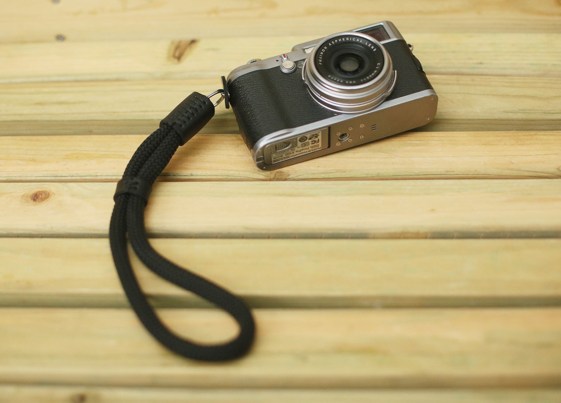 Smooth black leather detail on camera wrist strap