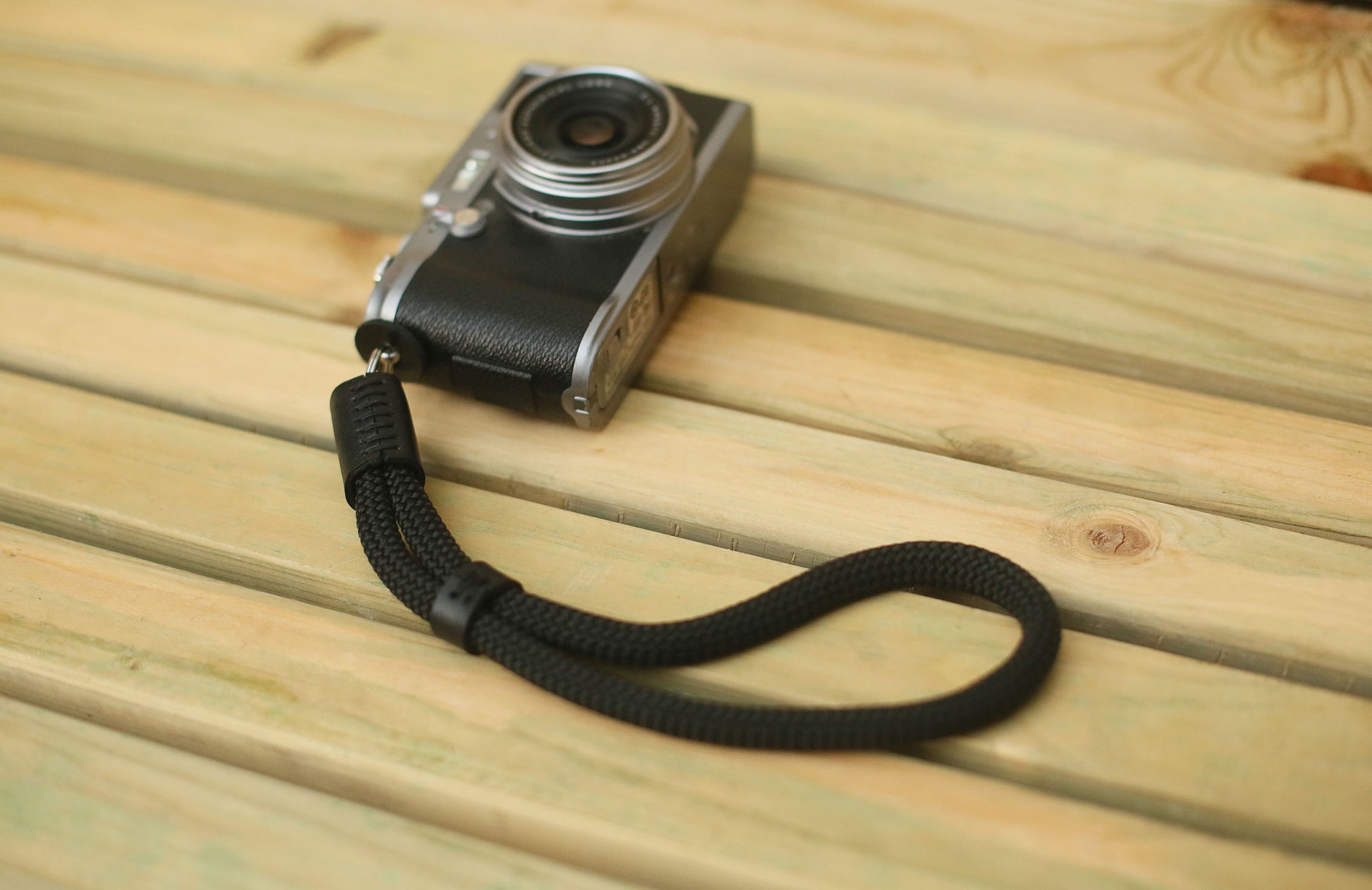 Leather guard pad on all-black wrist strap
