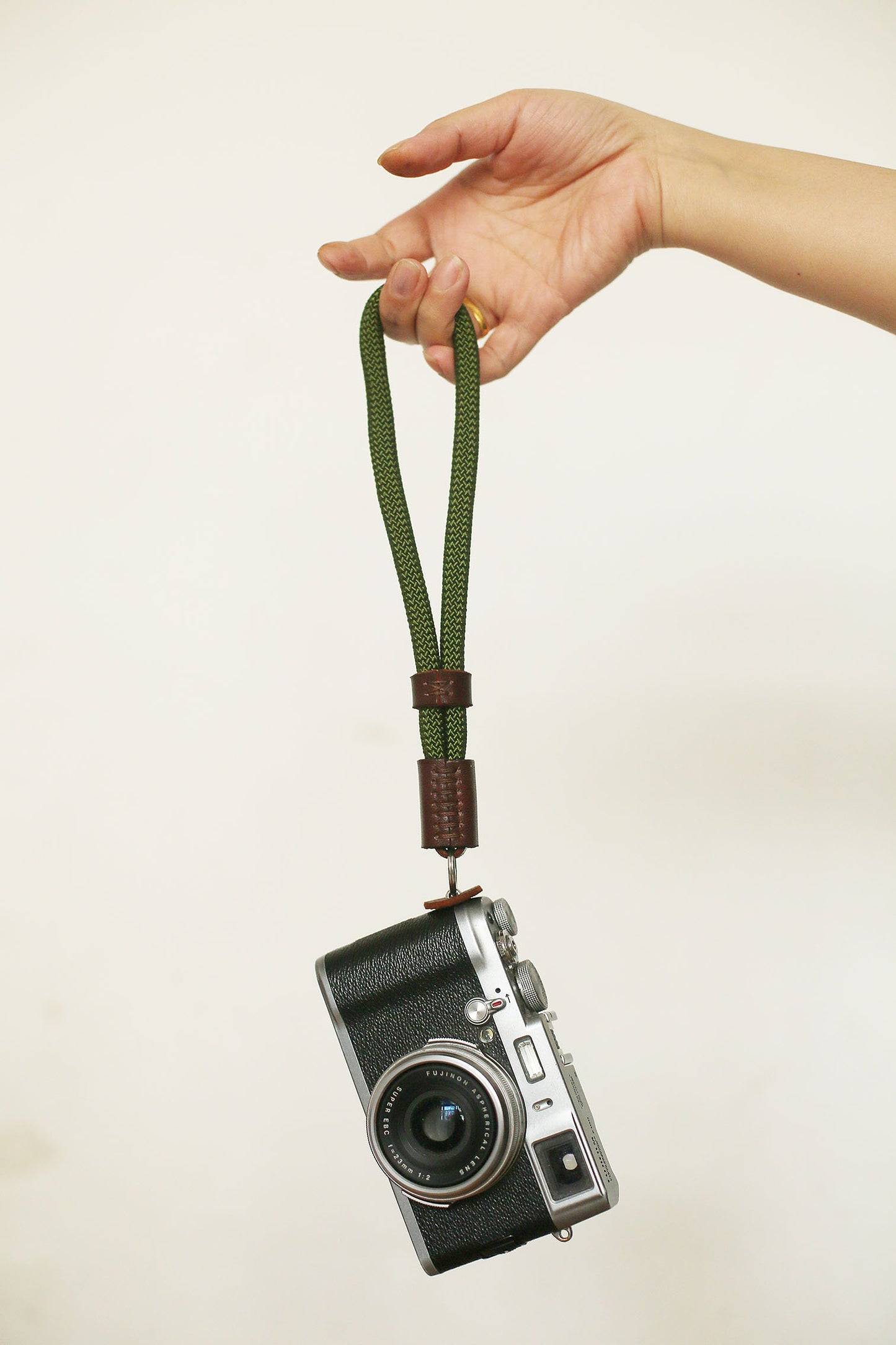 Army green climbing rope camera wrist strap with tan leather