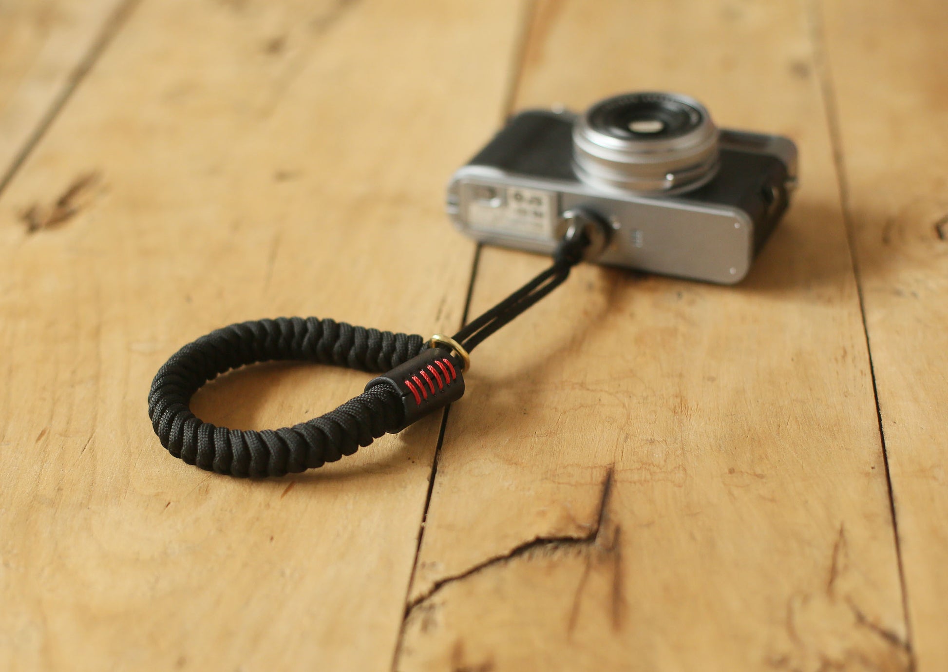 Stylish black and red handmade camera wristband