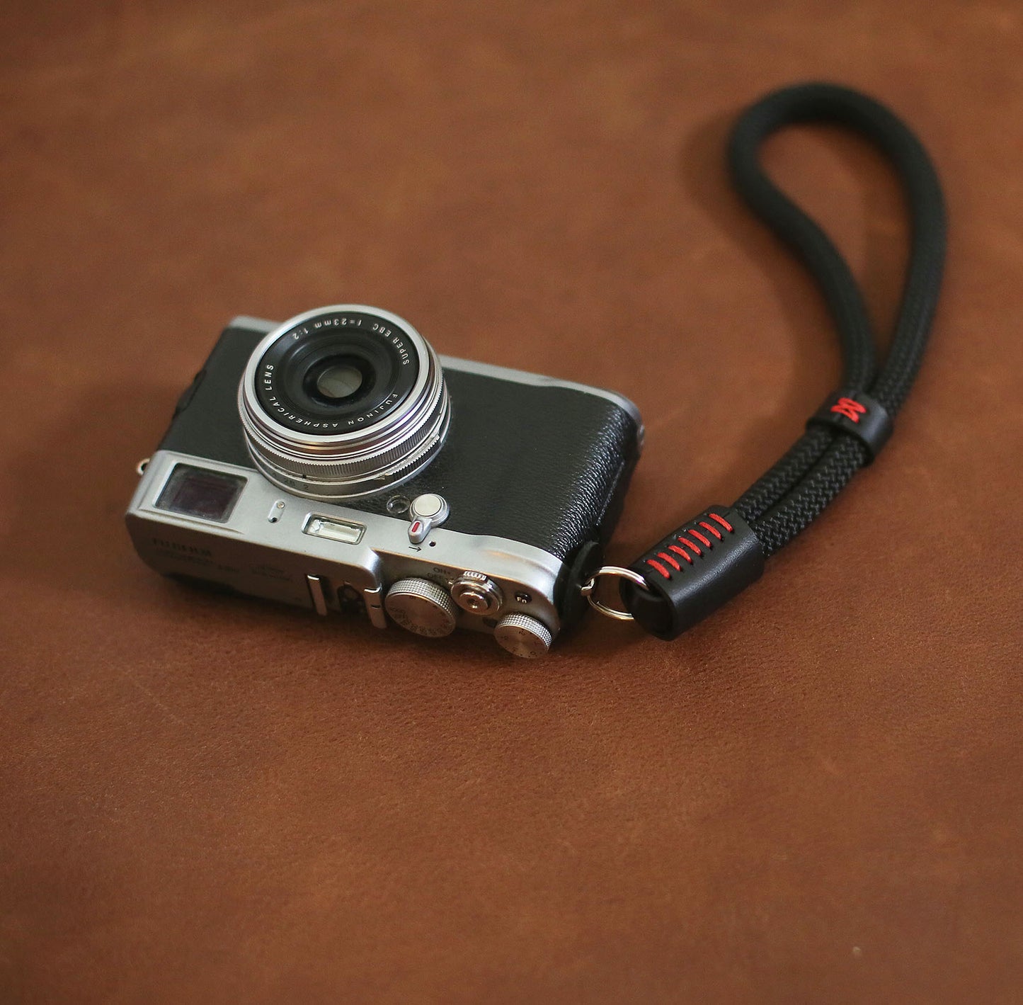 Black climbing rope camera wrist strap with red stitching