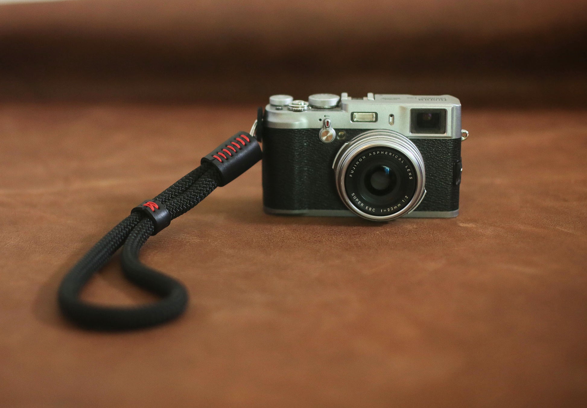 Leather guard pad on climbing rope camera strap