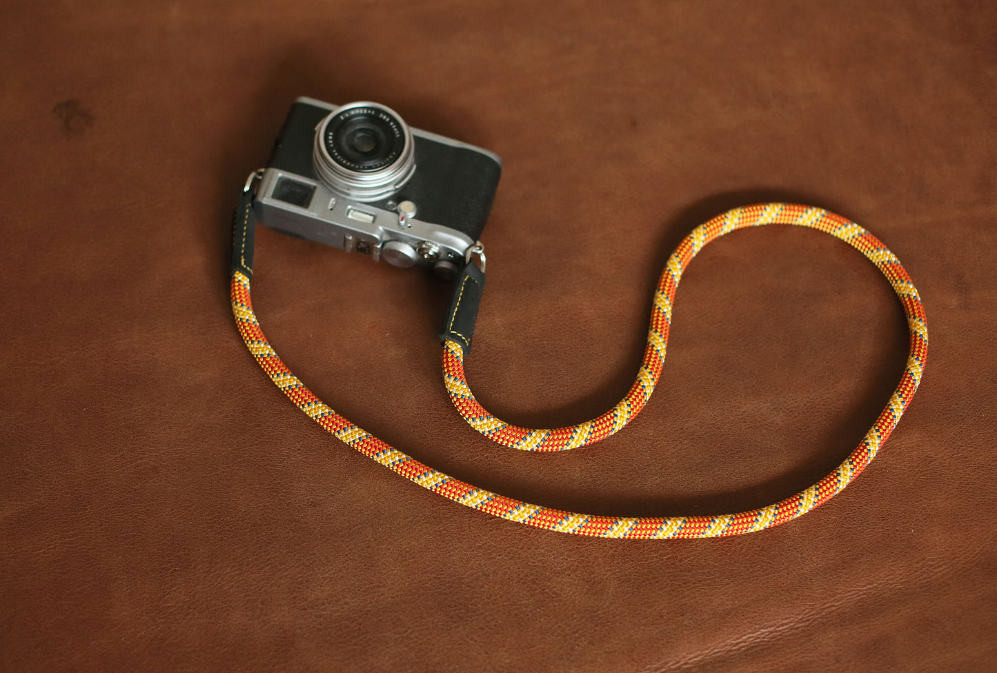Rugged orange and gold patterned rope strap with premium leather