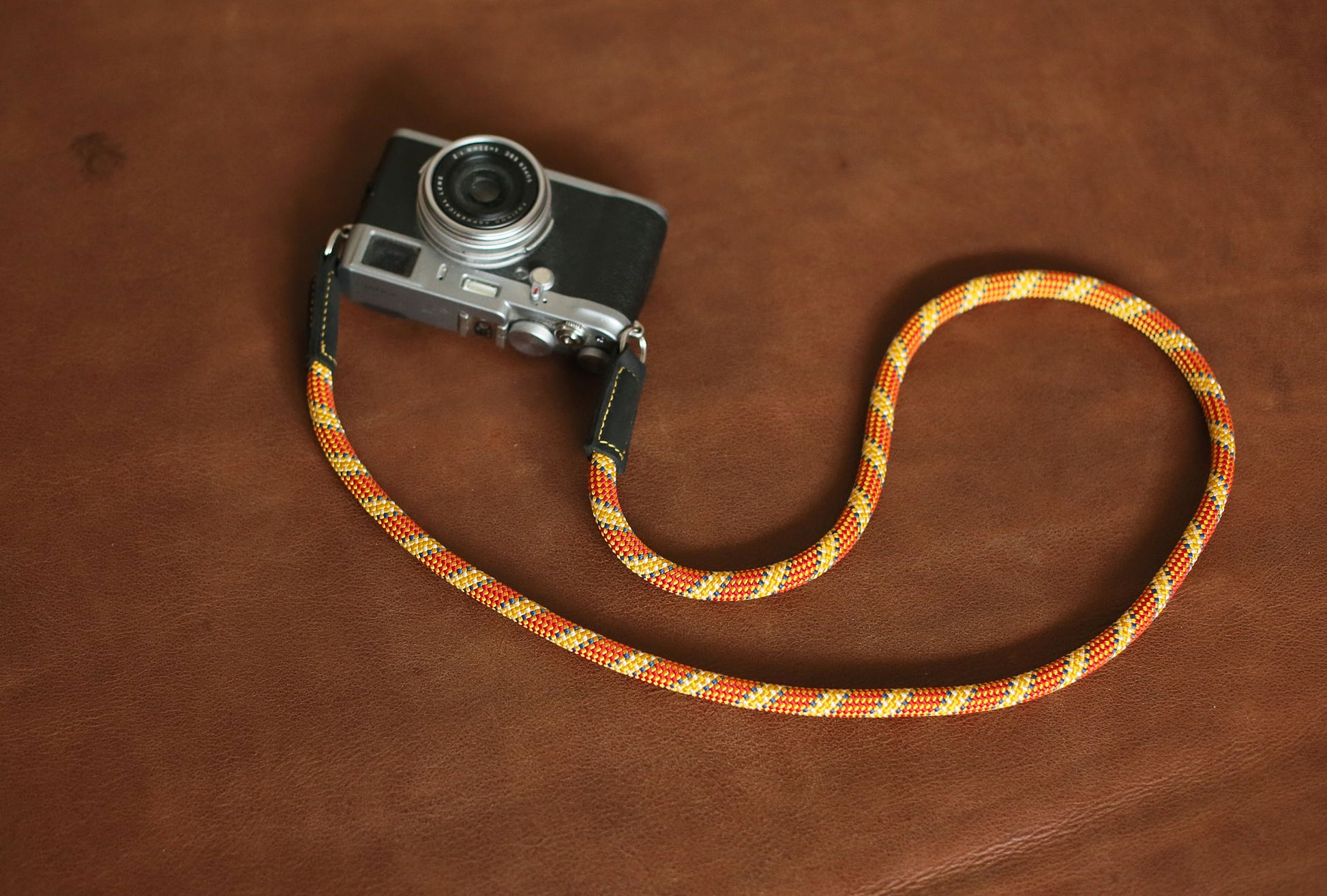 Rugged orange and gold patterned rope strap with premium leather