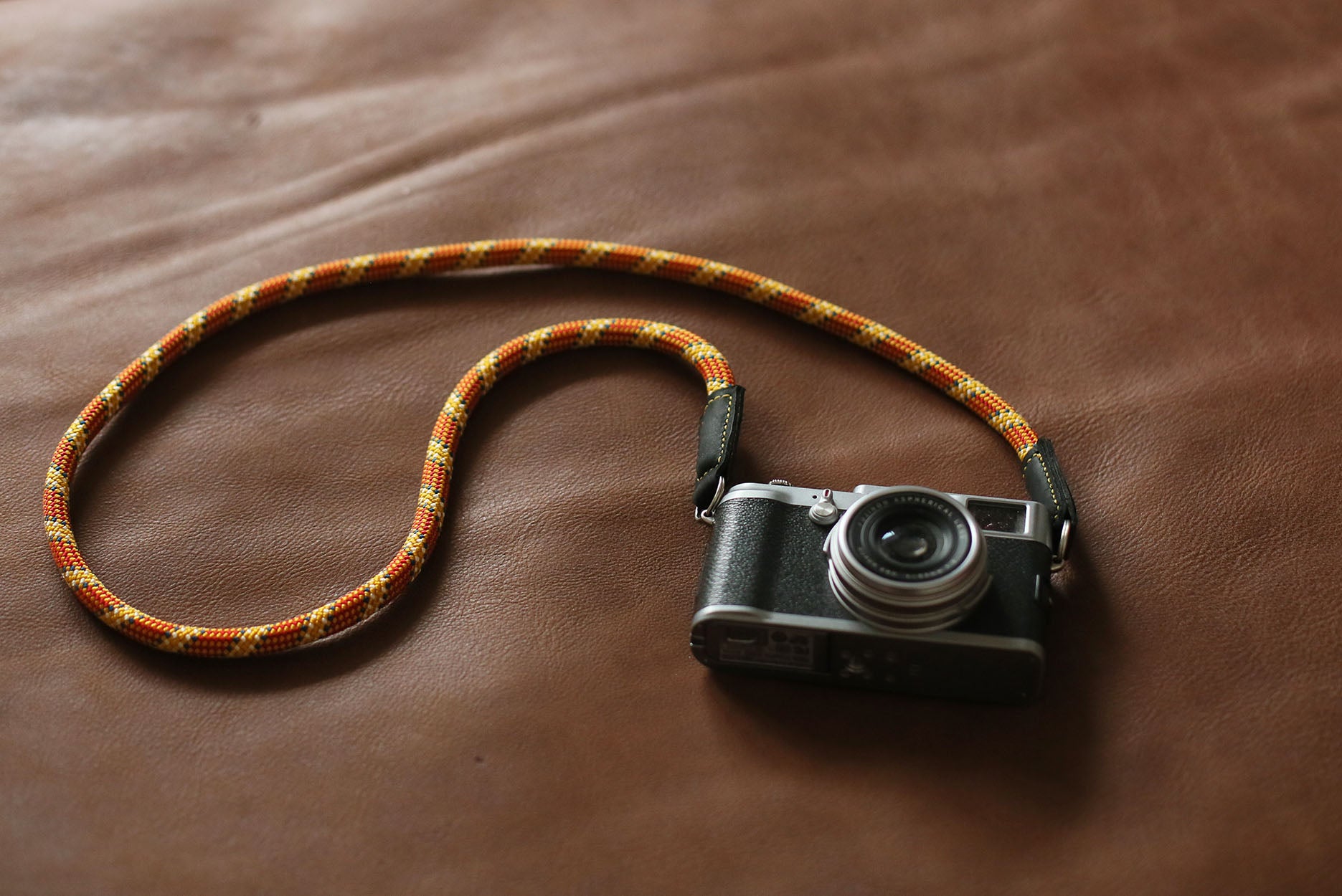 Handmade adjustable camera strap with orange climbing rope