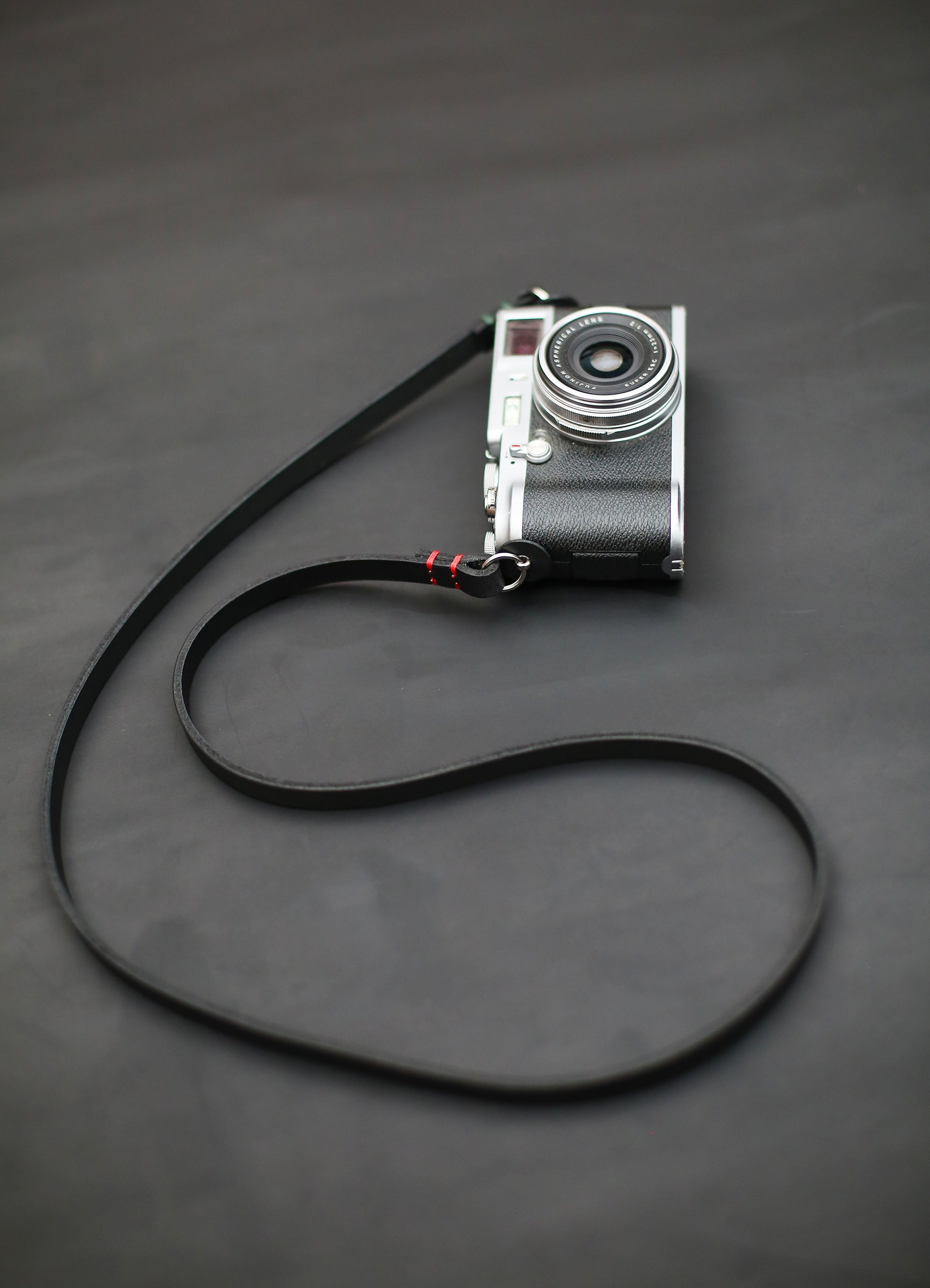 Premium full-grain black buffalo leather strap, durable and stylish for DSLR and mirrorless cameras