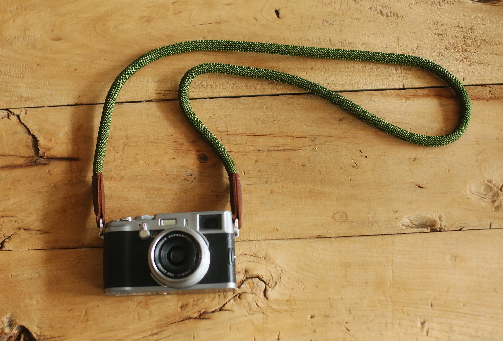 army green rope camera strap with tan leather