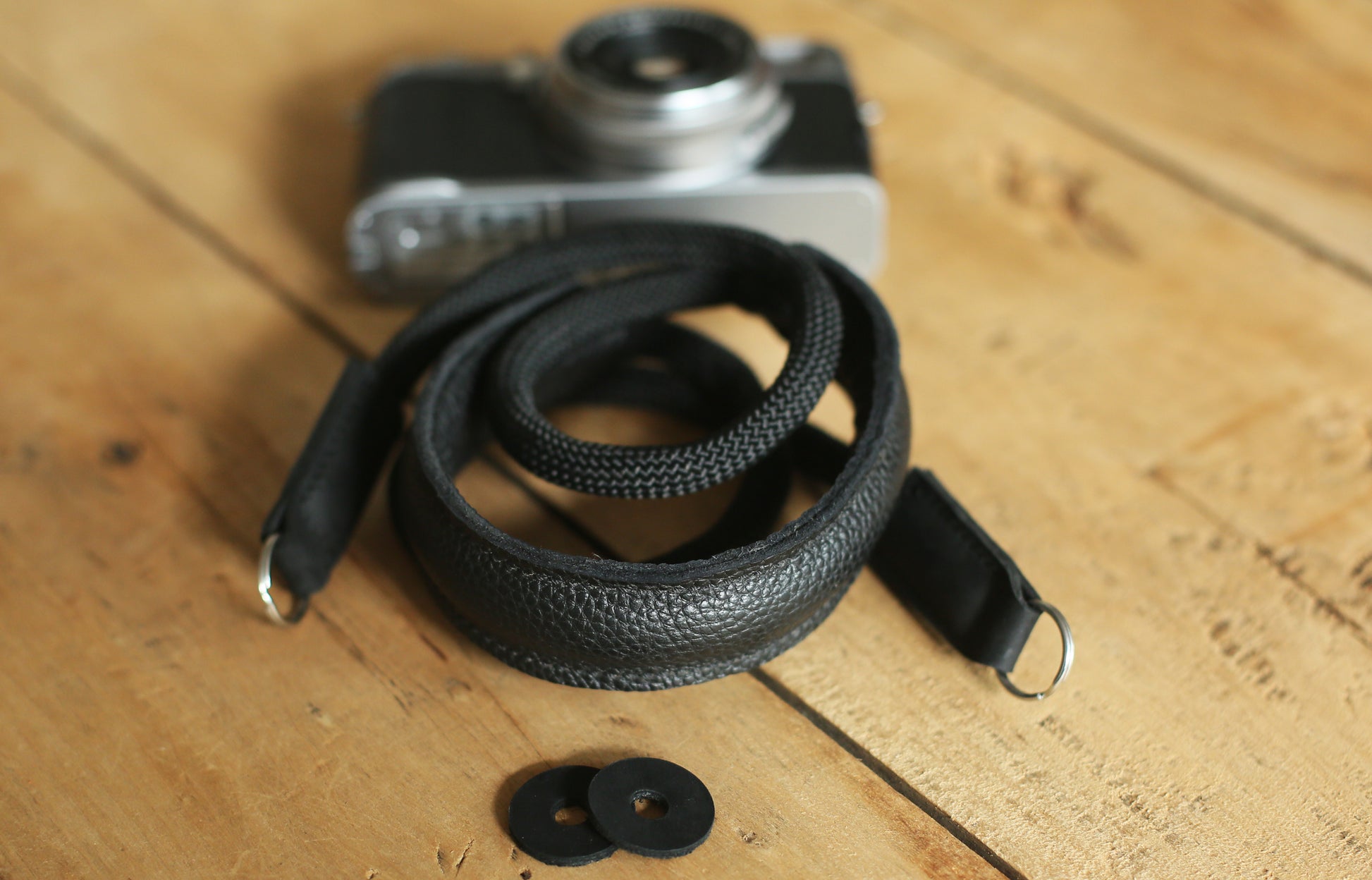 Close up of full grain leather ends connecting strap to camera lugs