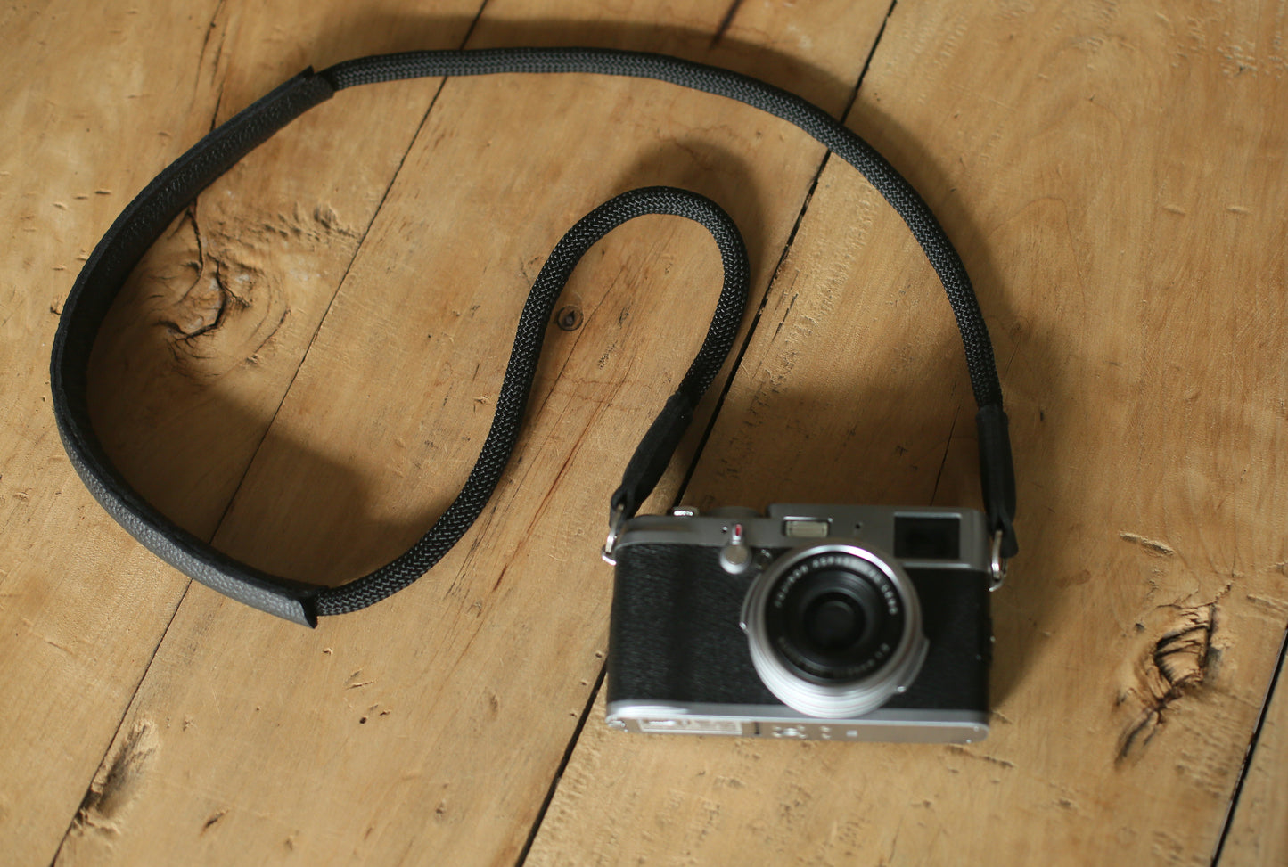 Detailed view of stitching and leather grain on shoulder pad part of strap