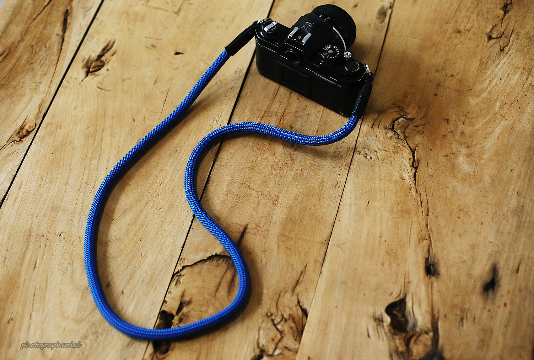 Side angle view showing dotted rope pattern and leather ends on strap