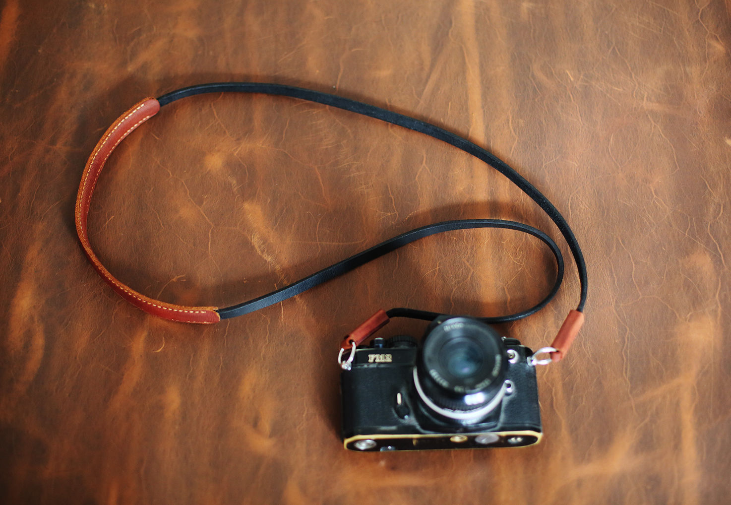 Adjustable leather camera strap with padded shoulder