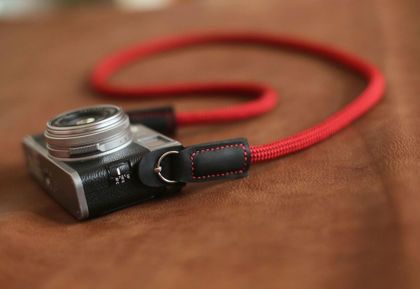 Adventure-ready red climbing rope camera strap