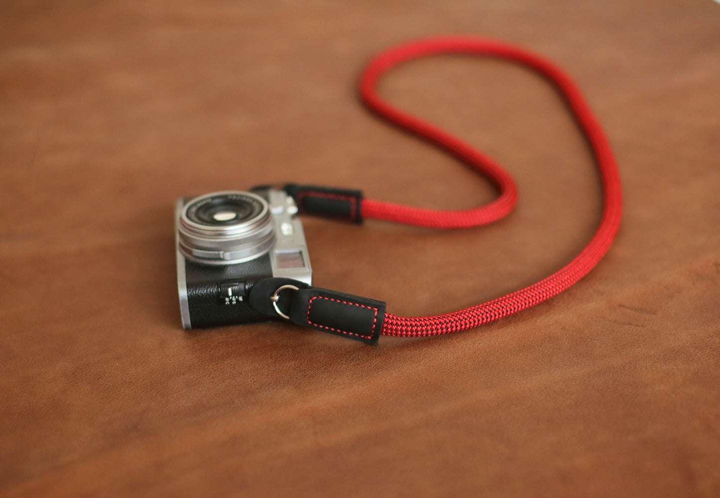 Unique black-speckled red climbing rope strap close-up