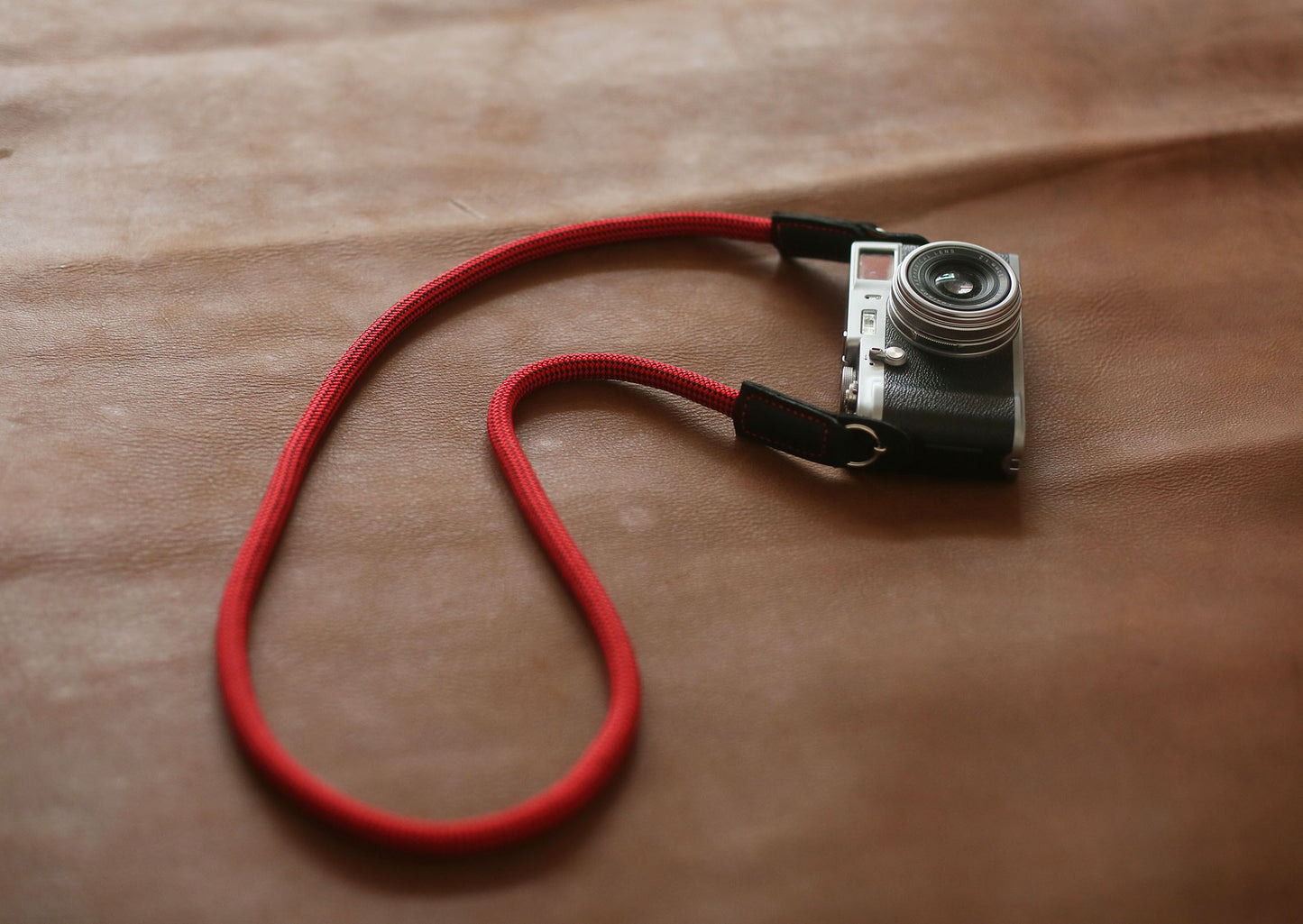 Durable red rope and black leather strap for adventure photography