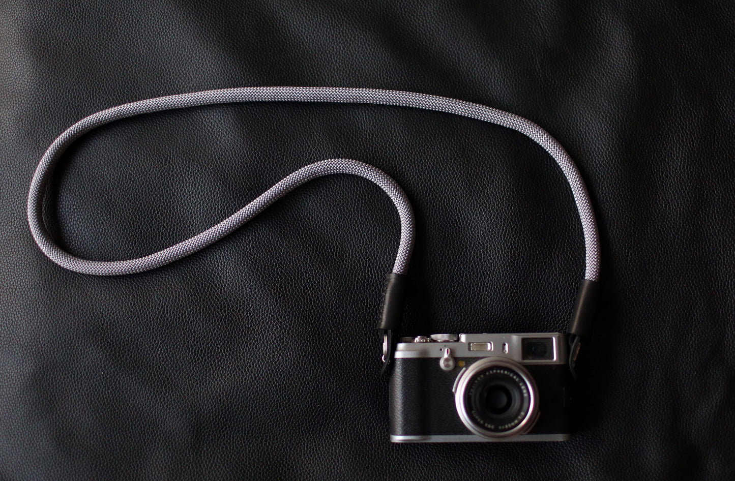 Close-up of leather end and stitching on gray climbing rope strap