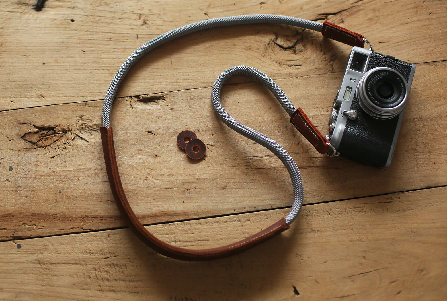 Close-up of brown leather pad stitched onto climbing rope strap