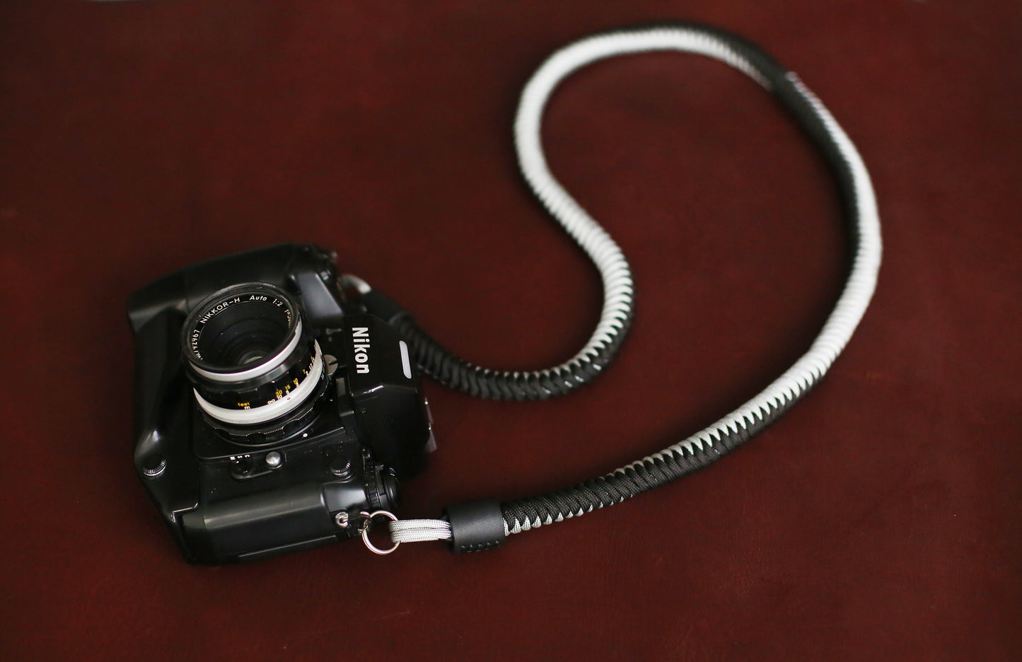Soft woven paracord camera strap in black and silver contrast colors