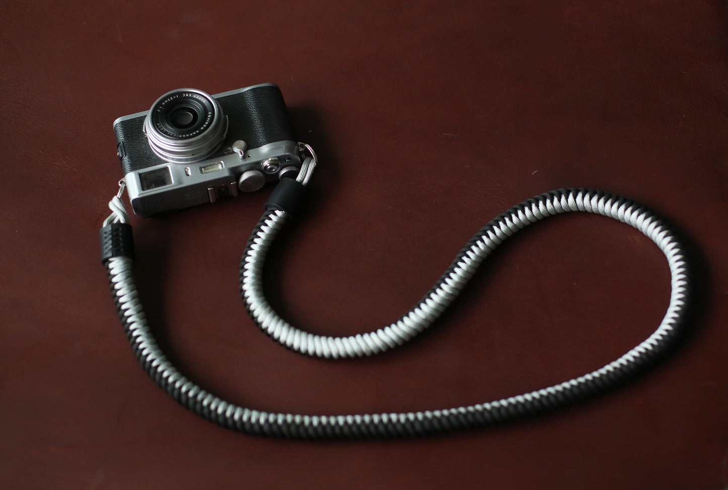 Adjustable black and silver braided strap for vintage film cameras