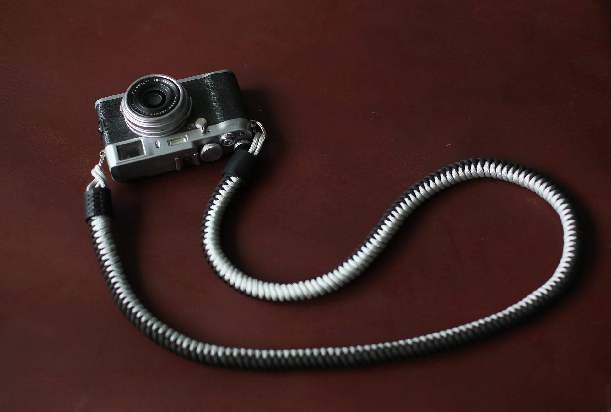 Adjustable black and silver braided strap for vintage film cameras