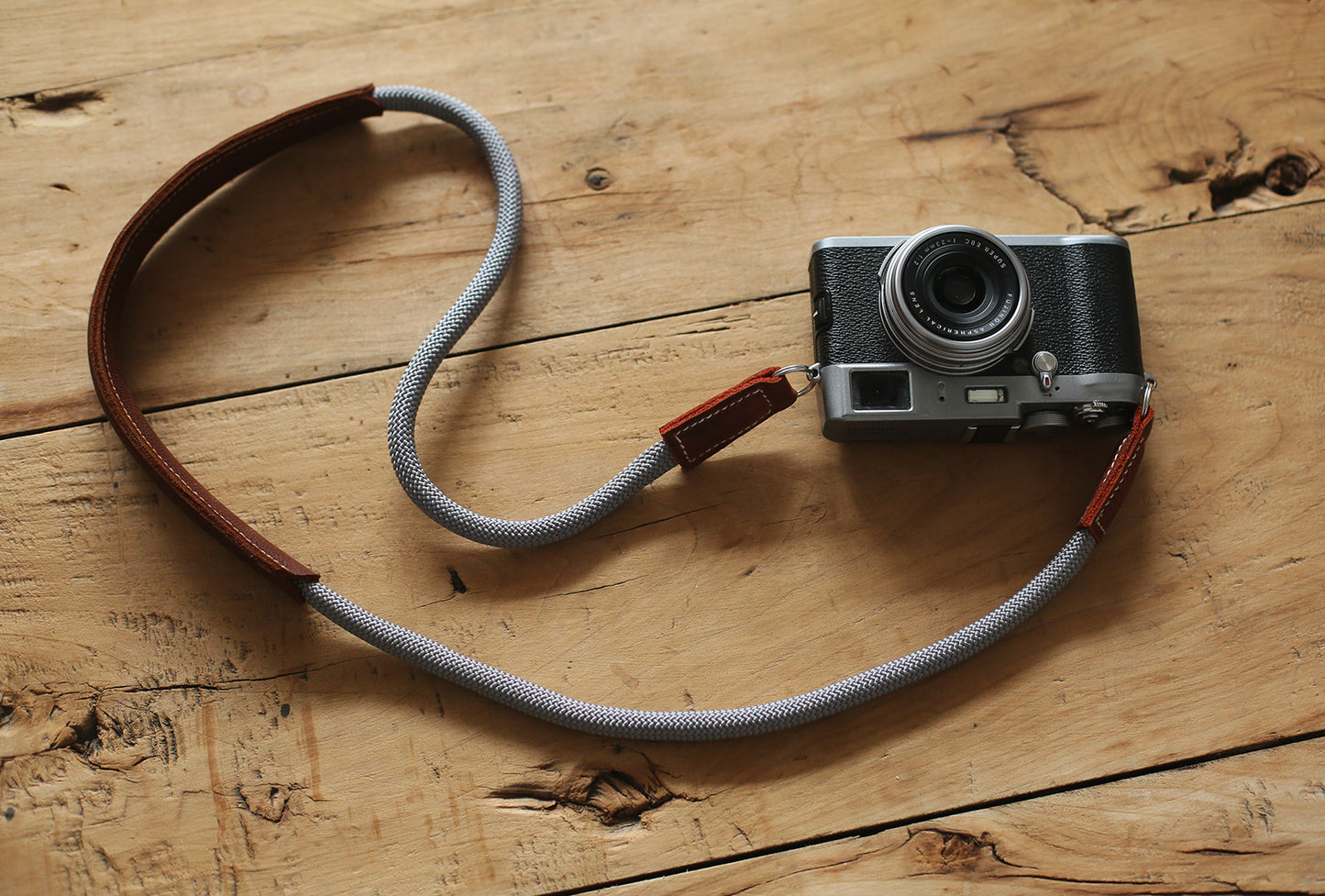 Brown leather shoulder pad showing curved ergonomic shape