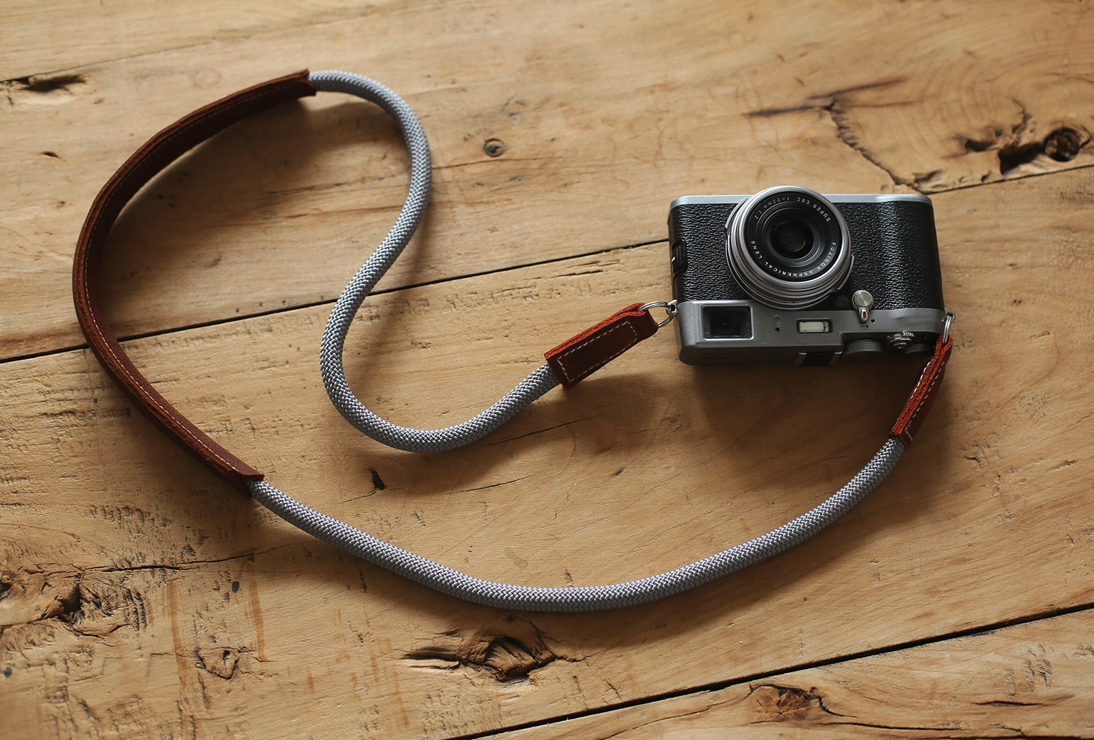 Brown leather shoulder pad showing curved ergonomic shape
