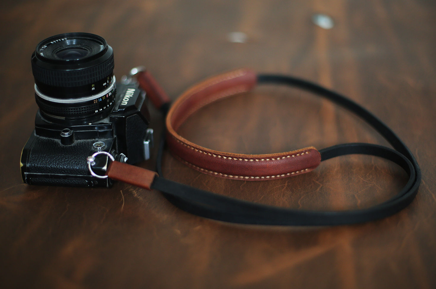 Classic two-tone leather strap on wooden table
