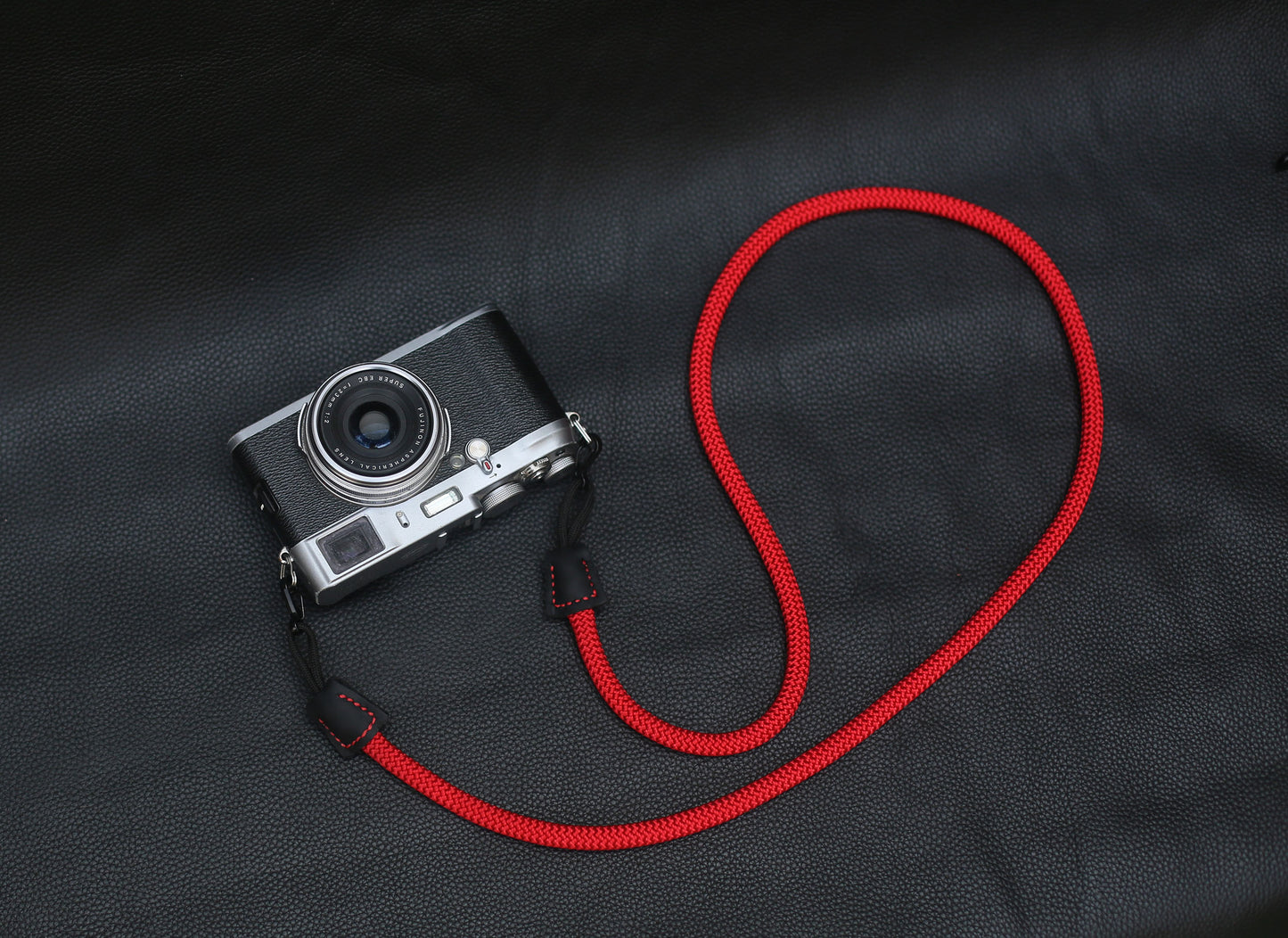 Handmade red climbing rope strap for mirrorless, SLR, and film cameras