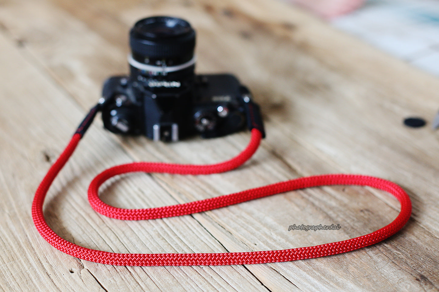 Vegetable-tanned leather end with red stitching