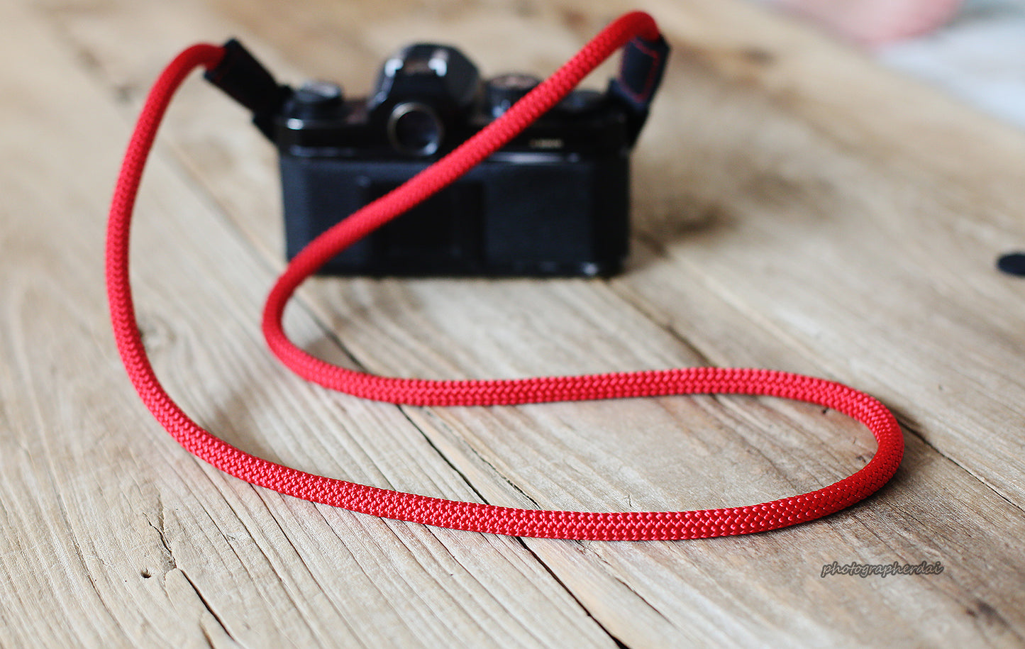 8mm red climbing rope strap displayed in a loop