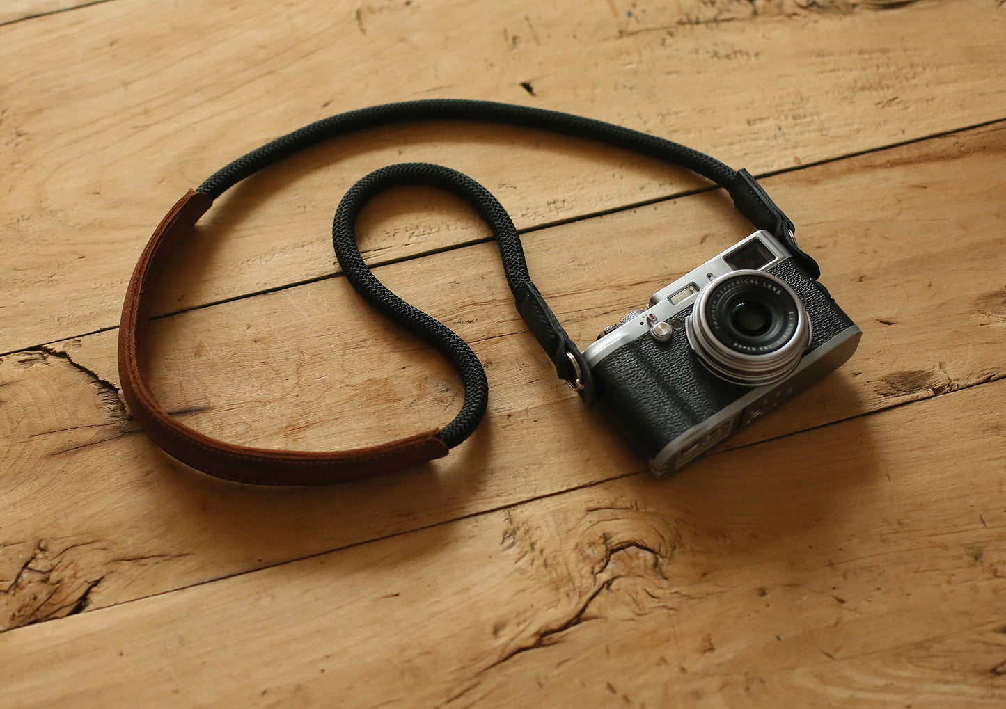 brown leather shoulder pad detail on handmade camera strap