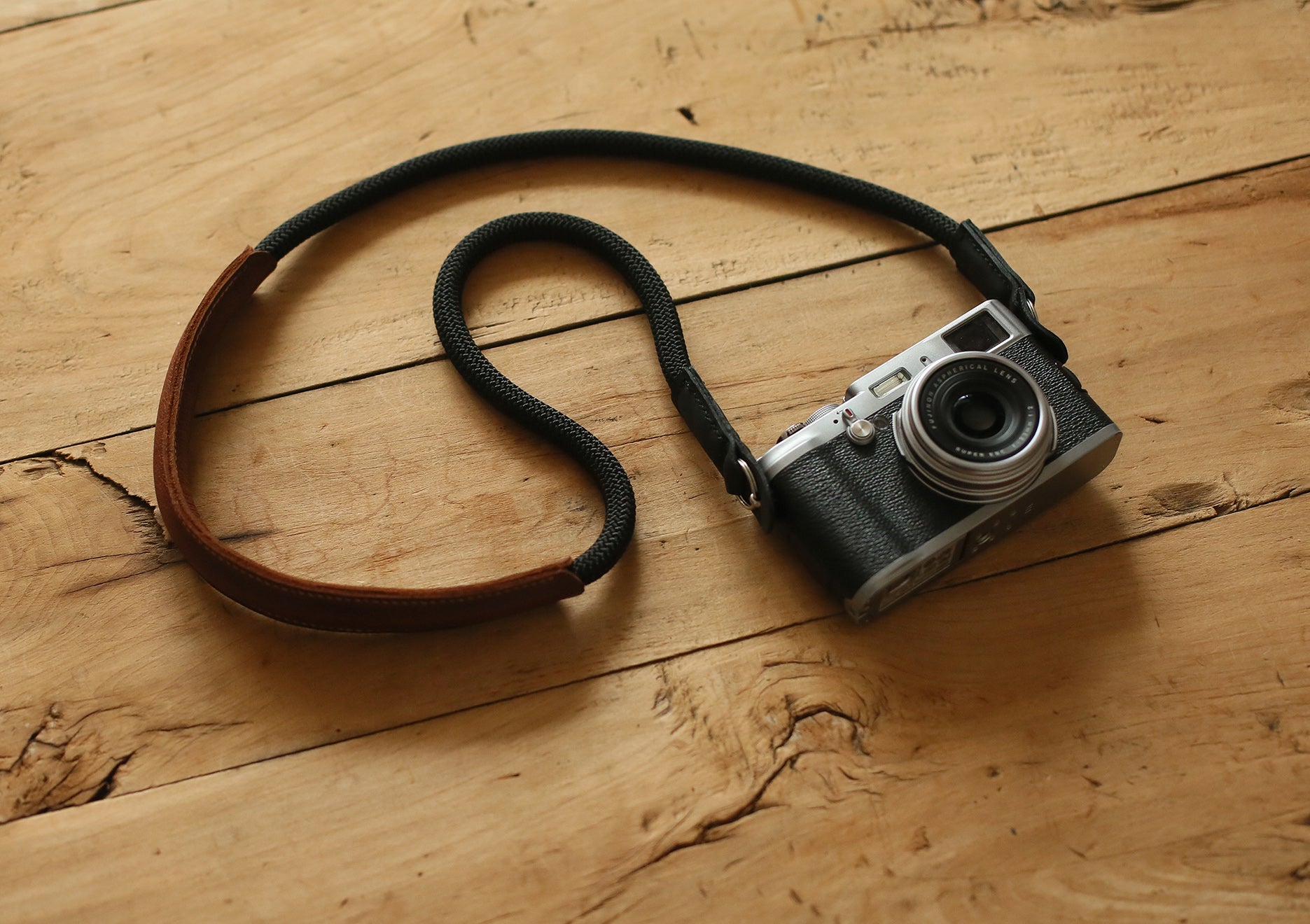 brown leather shoulder pad detail on handmade camera strap